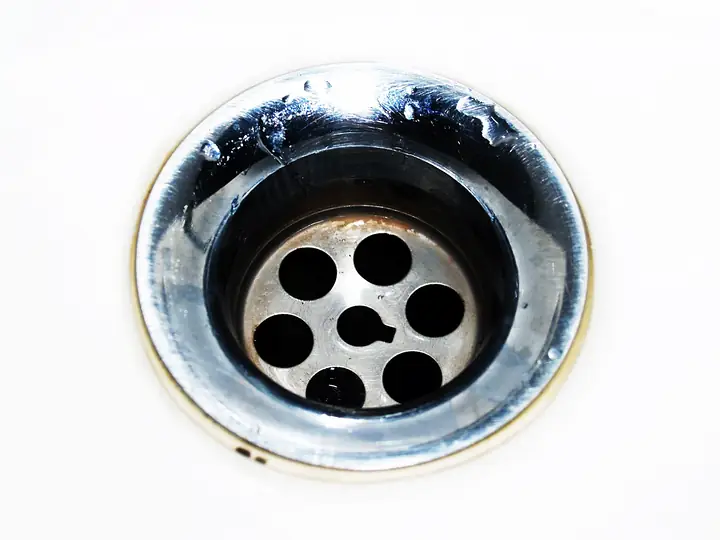 Close-up of a stainless steel sink drain