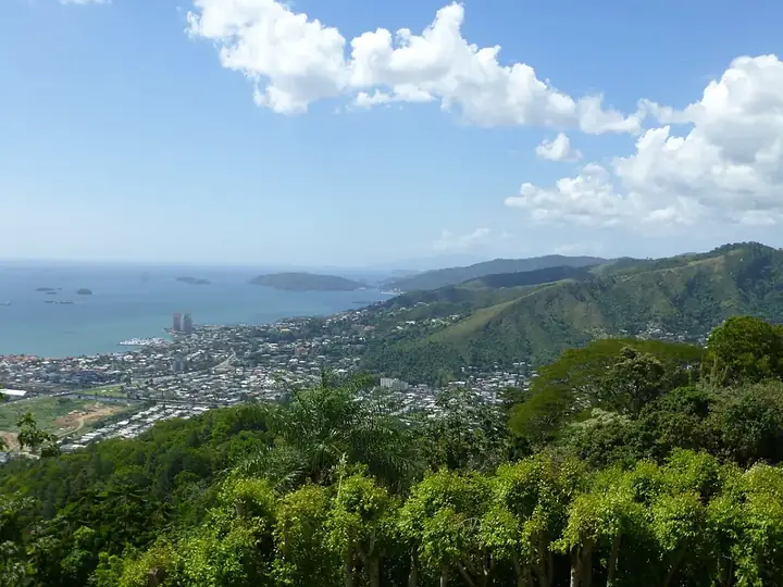 Western Main Road through Westmoorings, Diego Martin, with the Five Islands offshore
