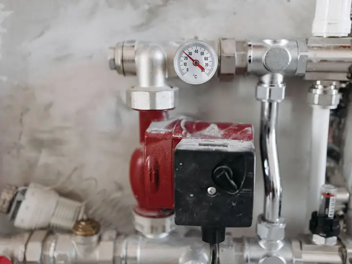 Water pipes with a pressure gauge and pump used to check for leaks